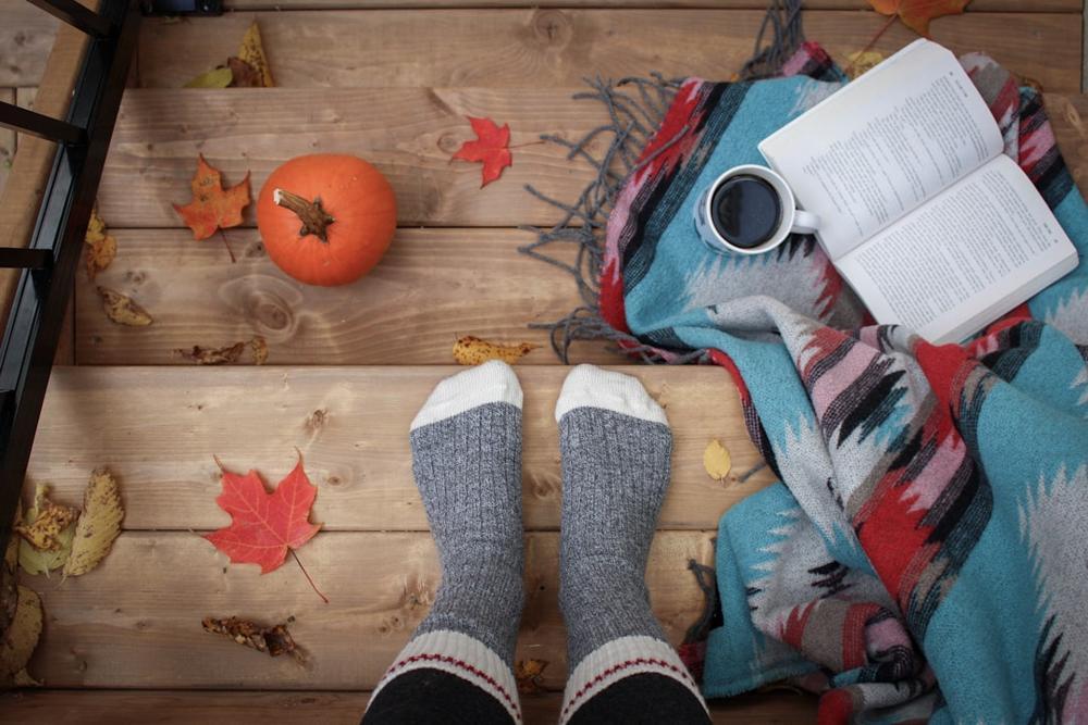A cozy NYC restaurant interior with fall decorations
