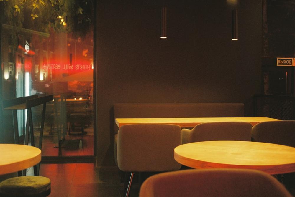 A warm, inviting restaurant interior with fall decorations