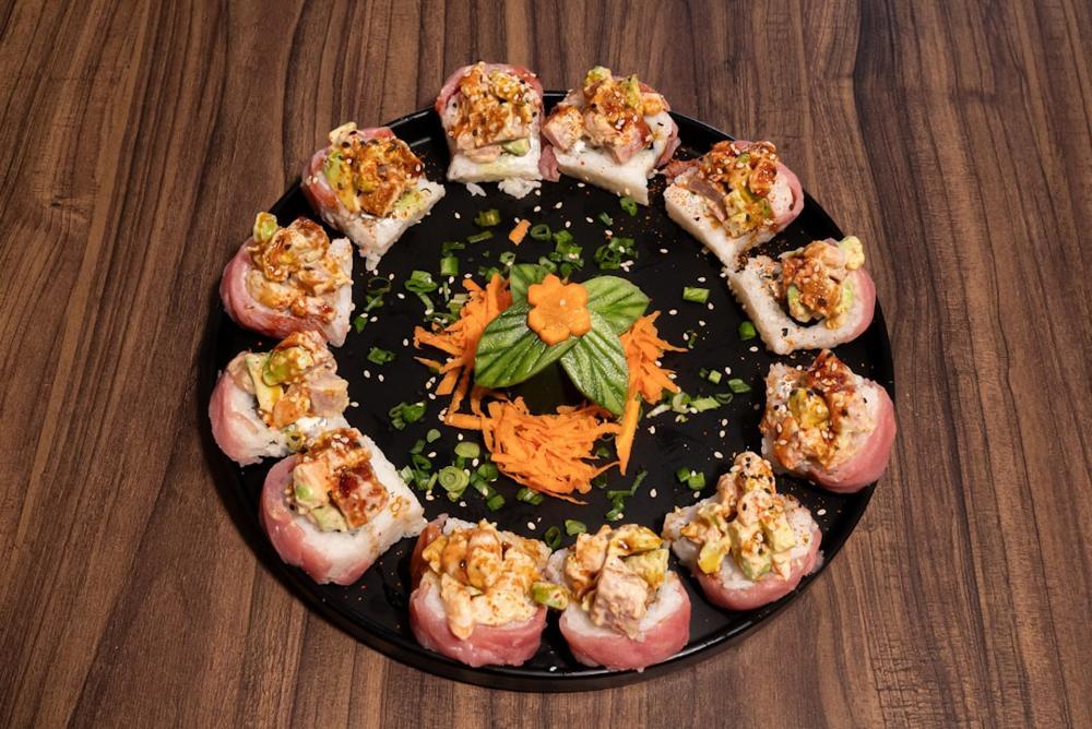 An elegant sushi platter featuring assorted nigiri and sashimi